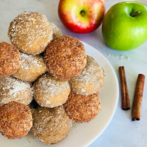 plate of apple cider and pumpkin spice donuts