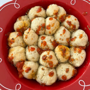plate of pizza bites with tomato sauce